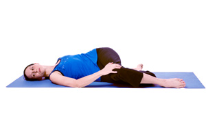 Supine cross-leg spinal twist